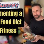 A man in a black T-shirt standing in a kitchen, holding a bowl of a healthy whole-food meal. Overlaid text reads: “Full Summary: Implementing a Whole Food Diet for Fitness.”