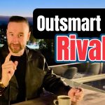 Andy Holt wearing a black leather jacket, seated on an outdoor terrace in Krakow, Poland at night with a river and lit-up bridge in the background. Overlaid text reads “Outsmart Your Rivals.”